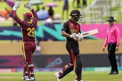 Nicholas Pooran celebrates Charles Amini's wicket